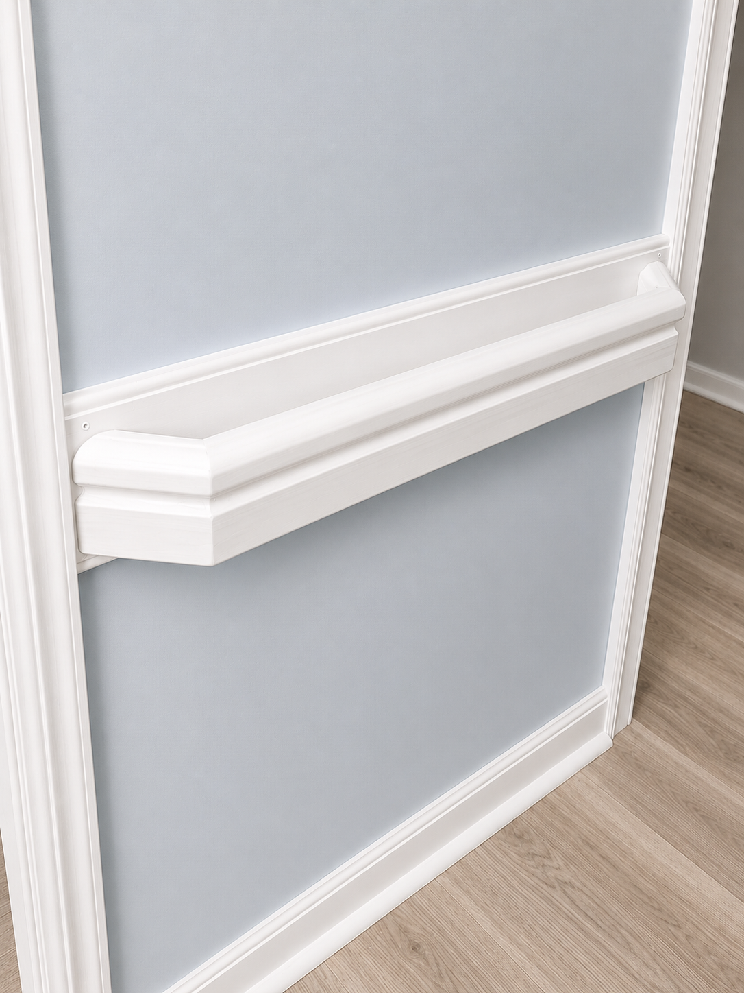 Custom trim-style grab bar mounted along a hallway wall