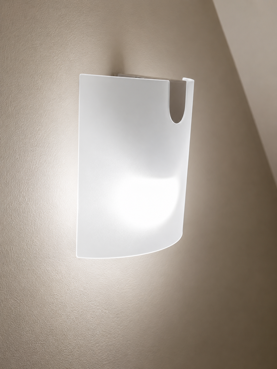 Motion sensor wall light illuminating a hallway at night