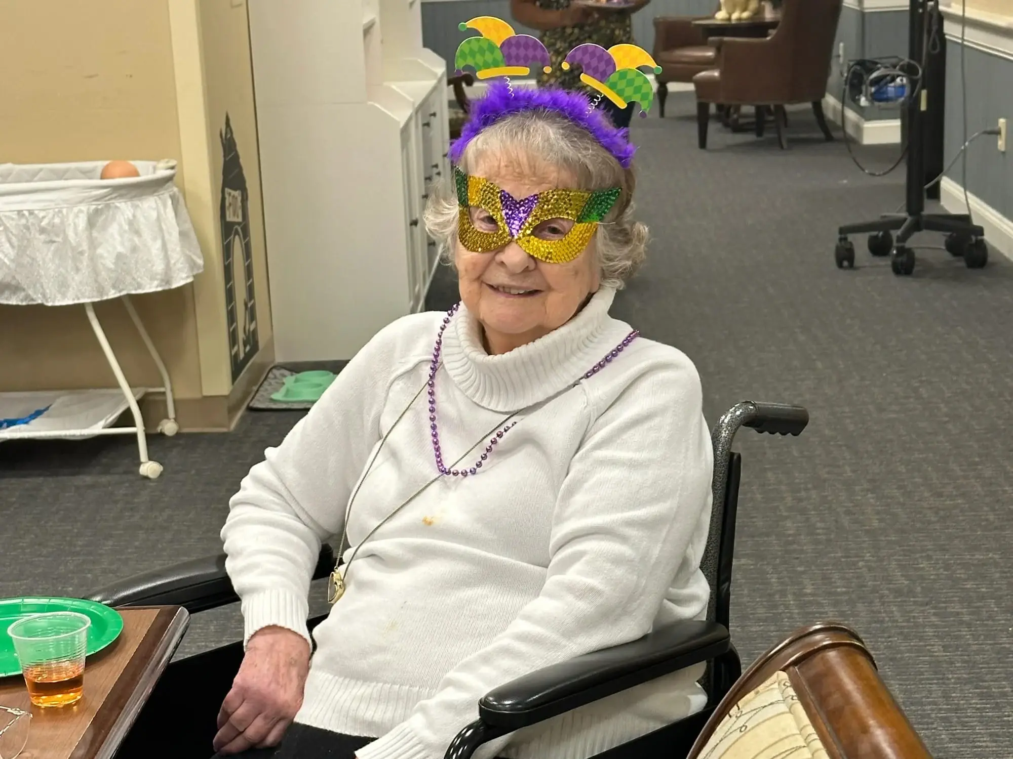 Burnie wearing a Mardi Gras mask