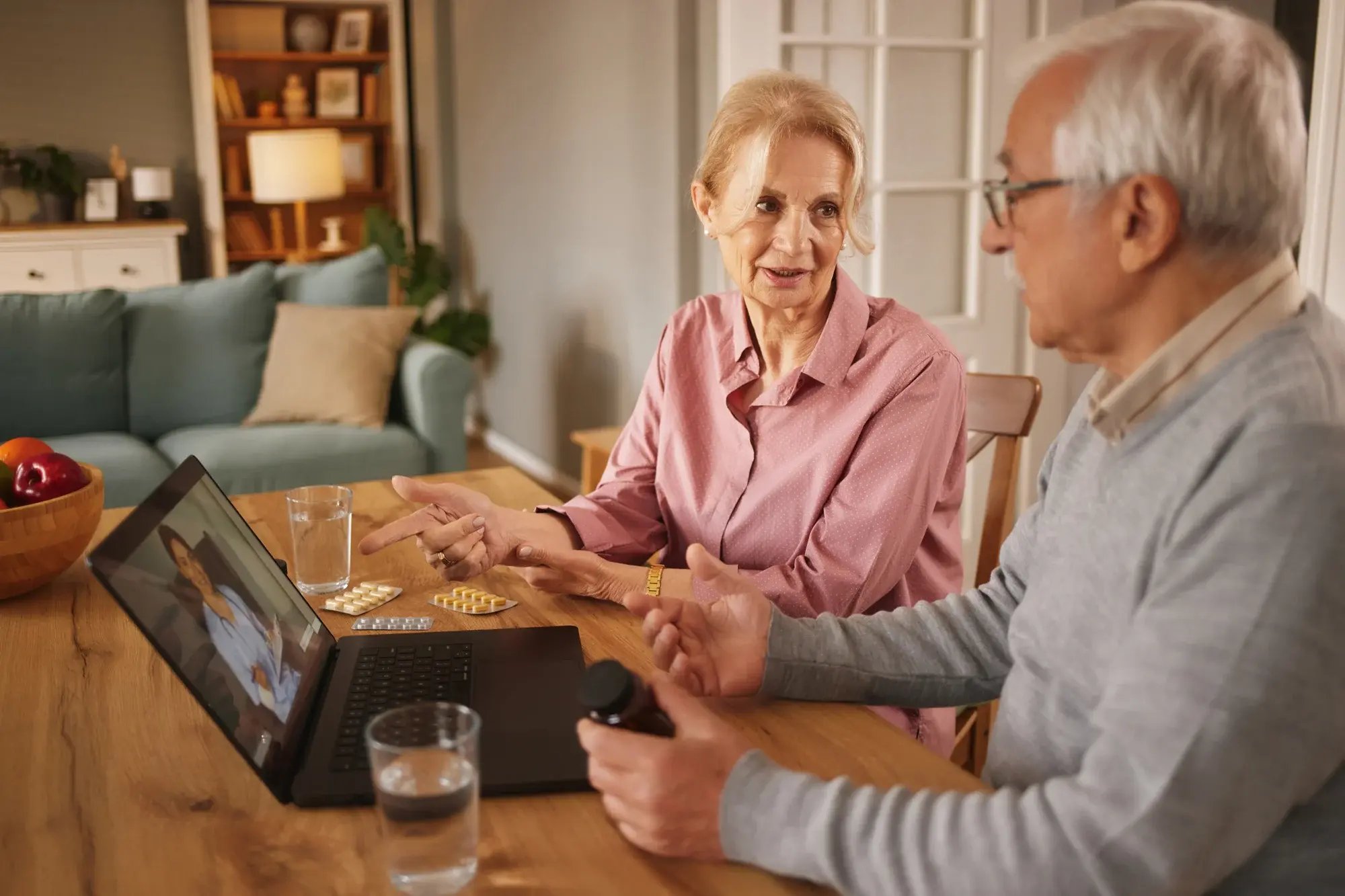 Senior couple sitting at computer