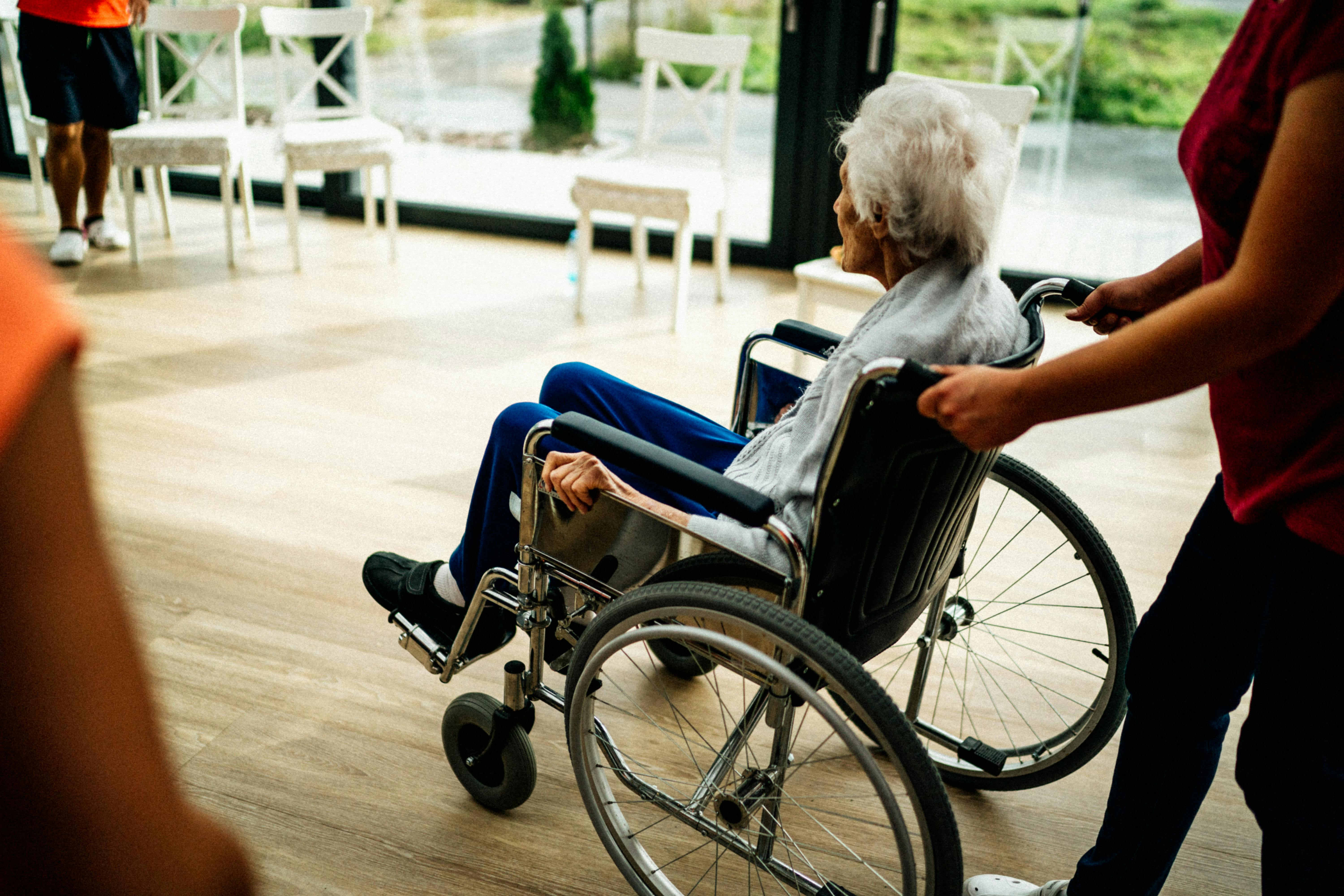 A well-lit hallway with motion-sensor lights and clear pathways for fall prevention - overnight elder care