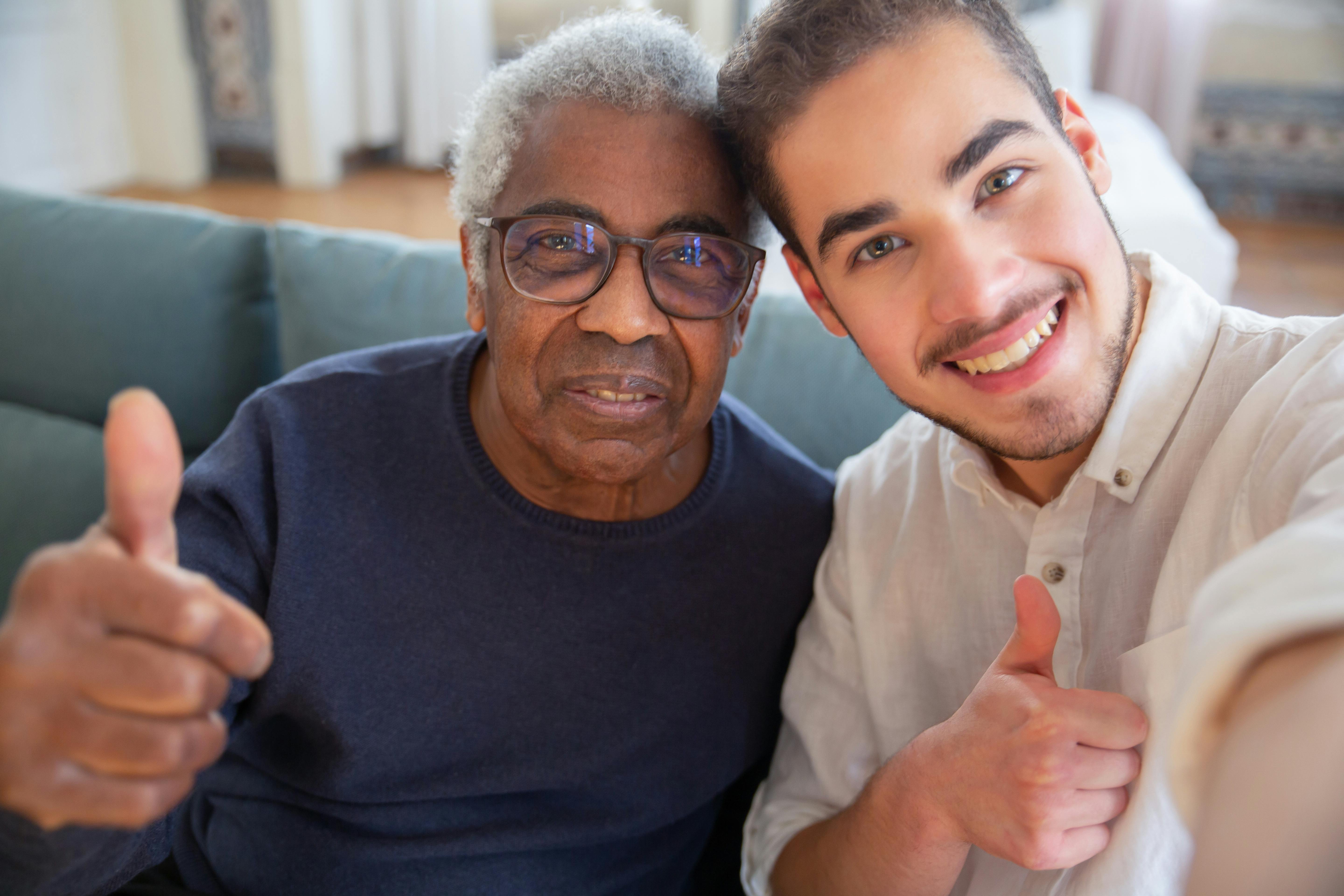 senior and companion smiling during home visit - care giver grants