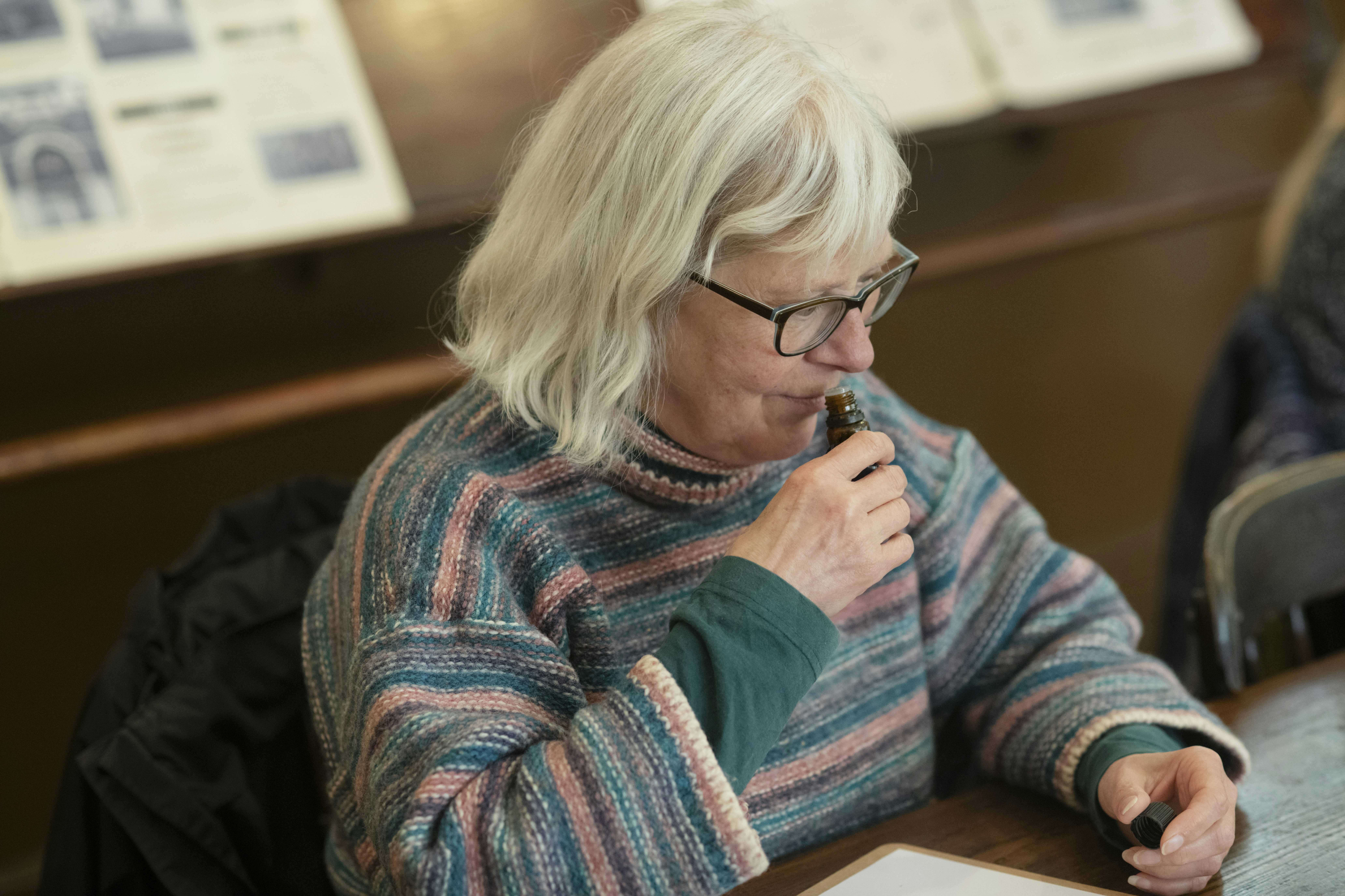 Senior looking at a pill organizer to manage multiple medications safely - help looking after elderly parents
