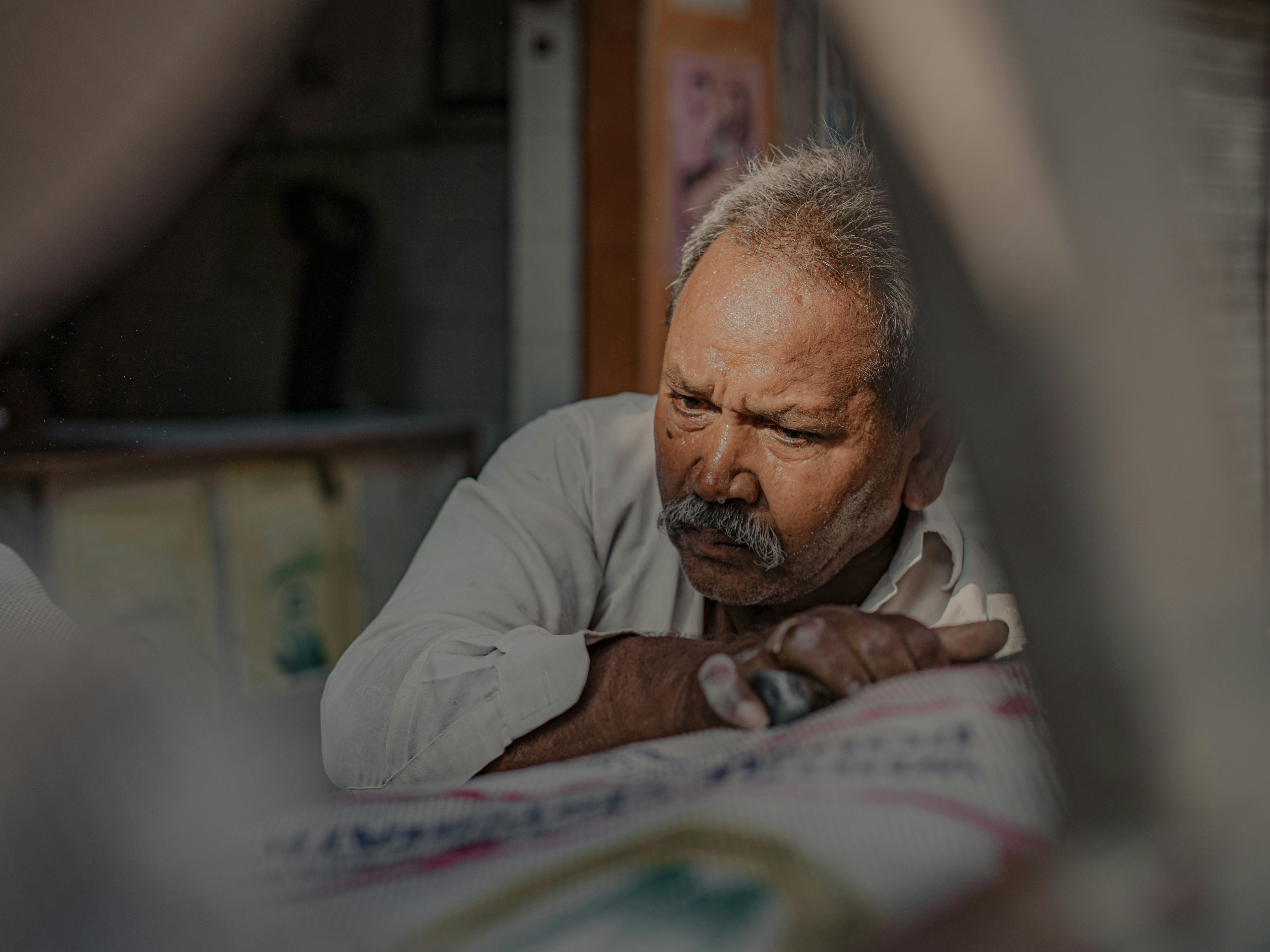 Senior adult looking confused while holding multiple prescription bottles - medication management services