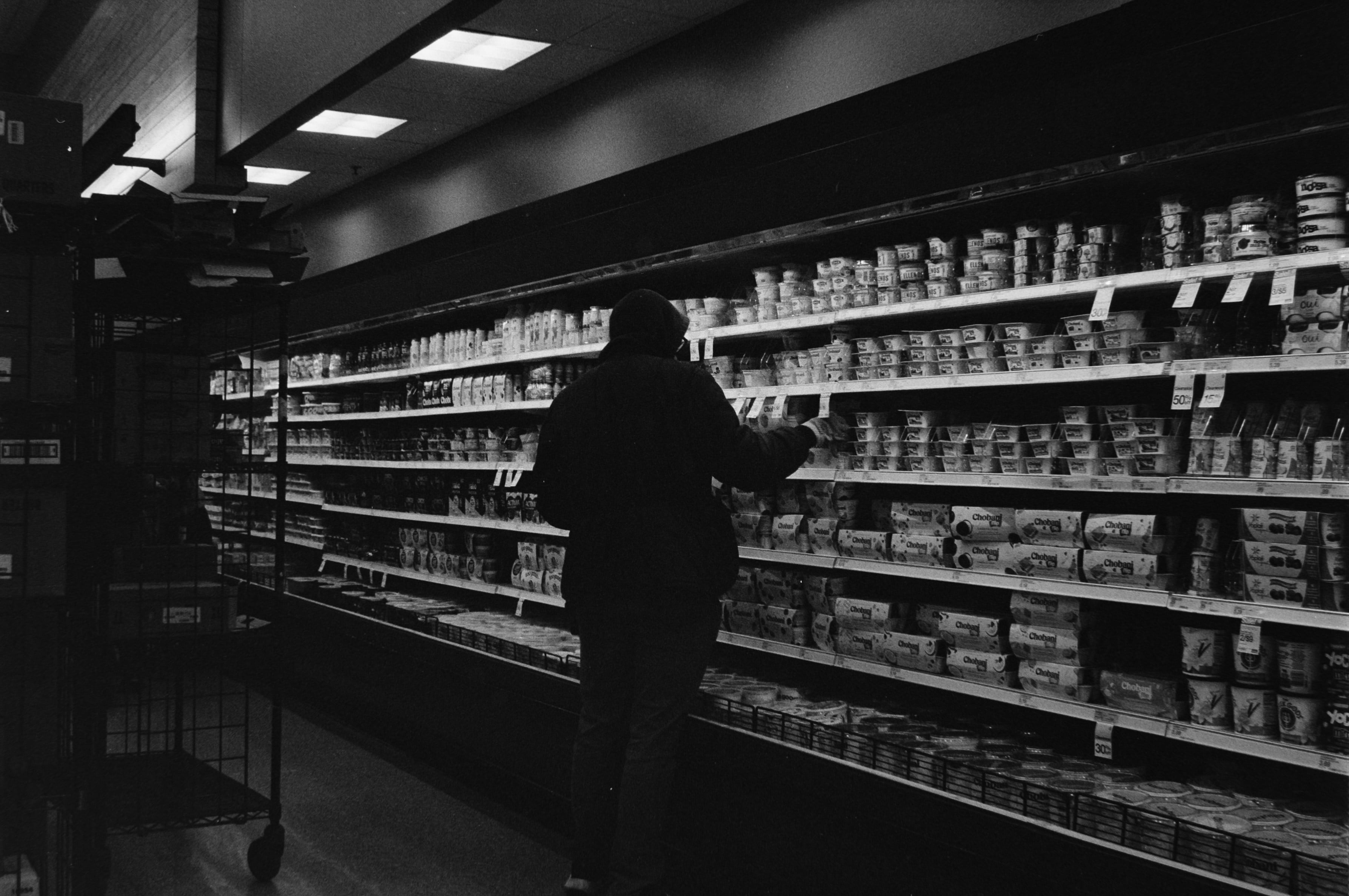 helper navigating a supermarket aisle - grocery shopping assistance